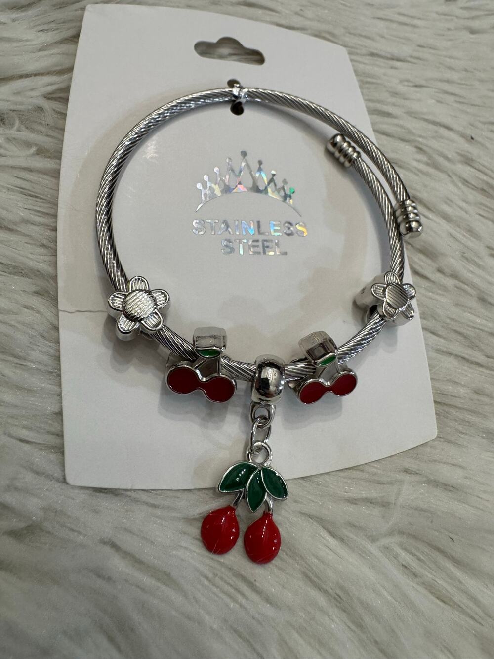Cherry stainless steel bangle bracelet with red cherry charms and green leaves